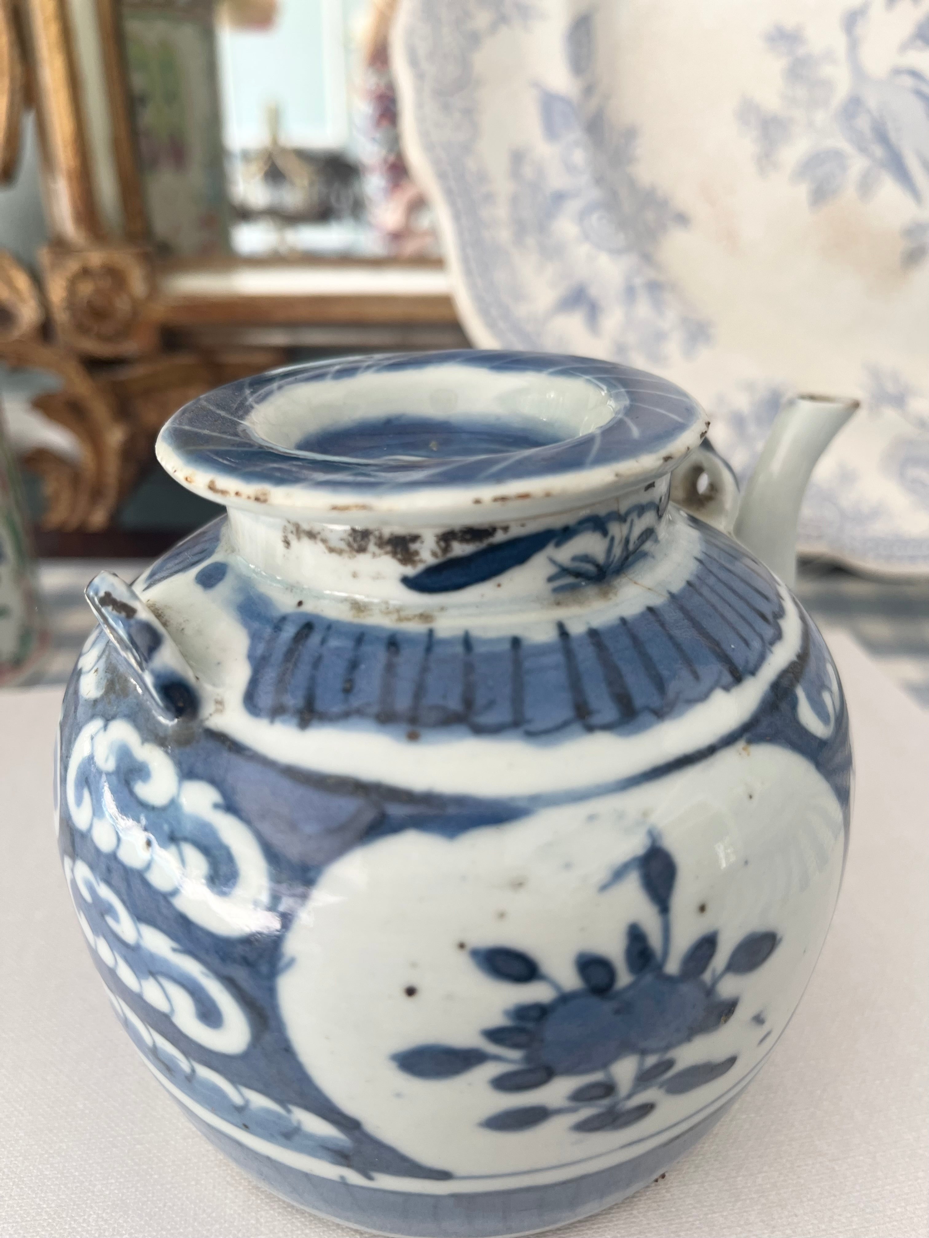 Antique Blue and White Teapot with Floral and Wave Motif