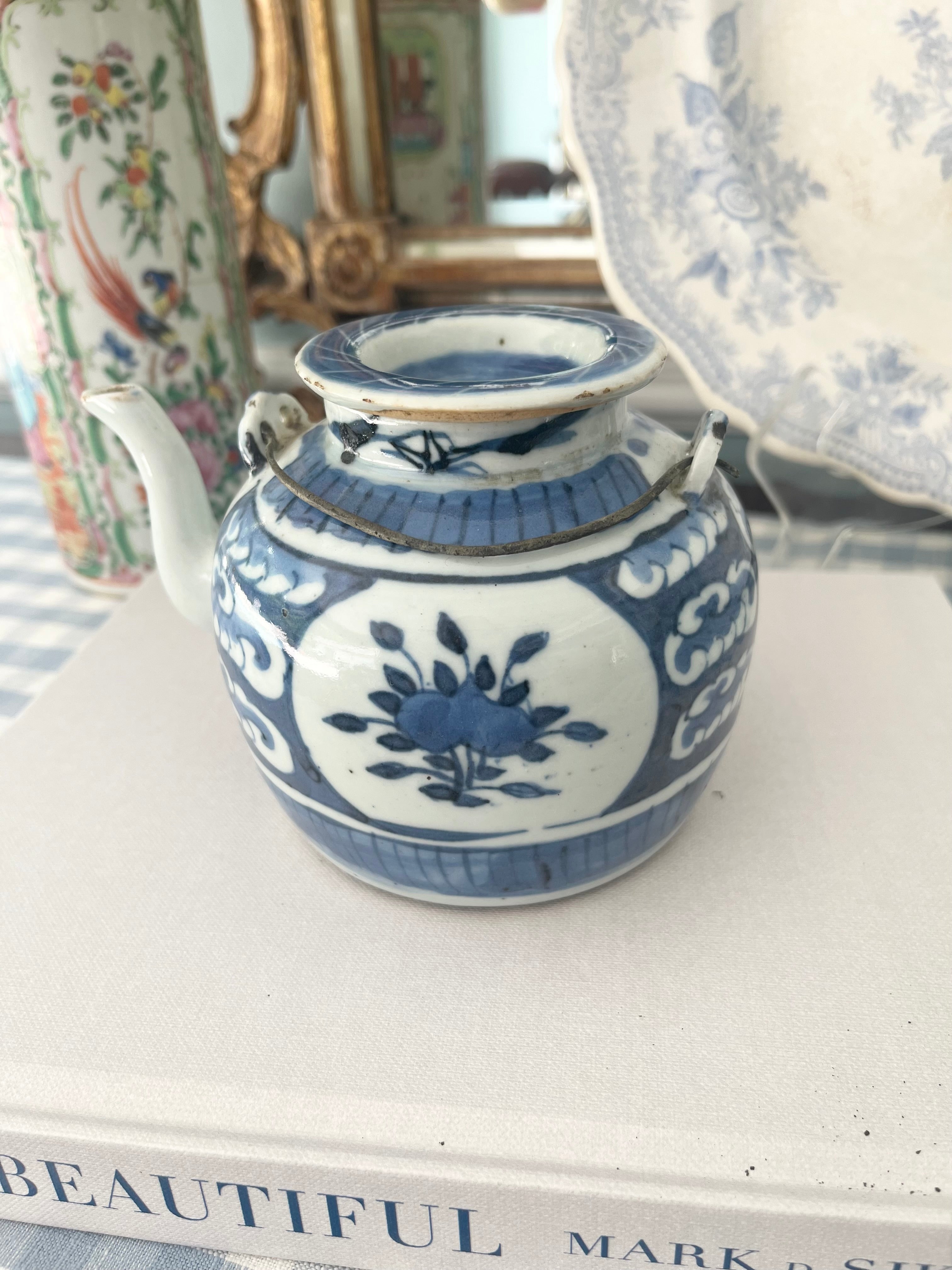 Antique Blue and White Teapot with Floral and Wave Motif