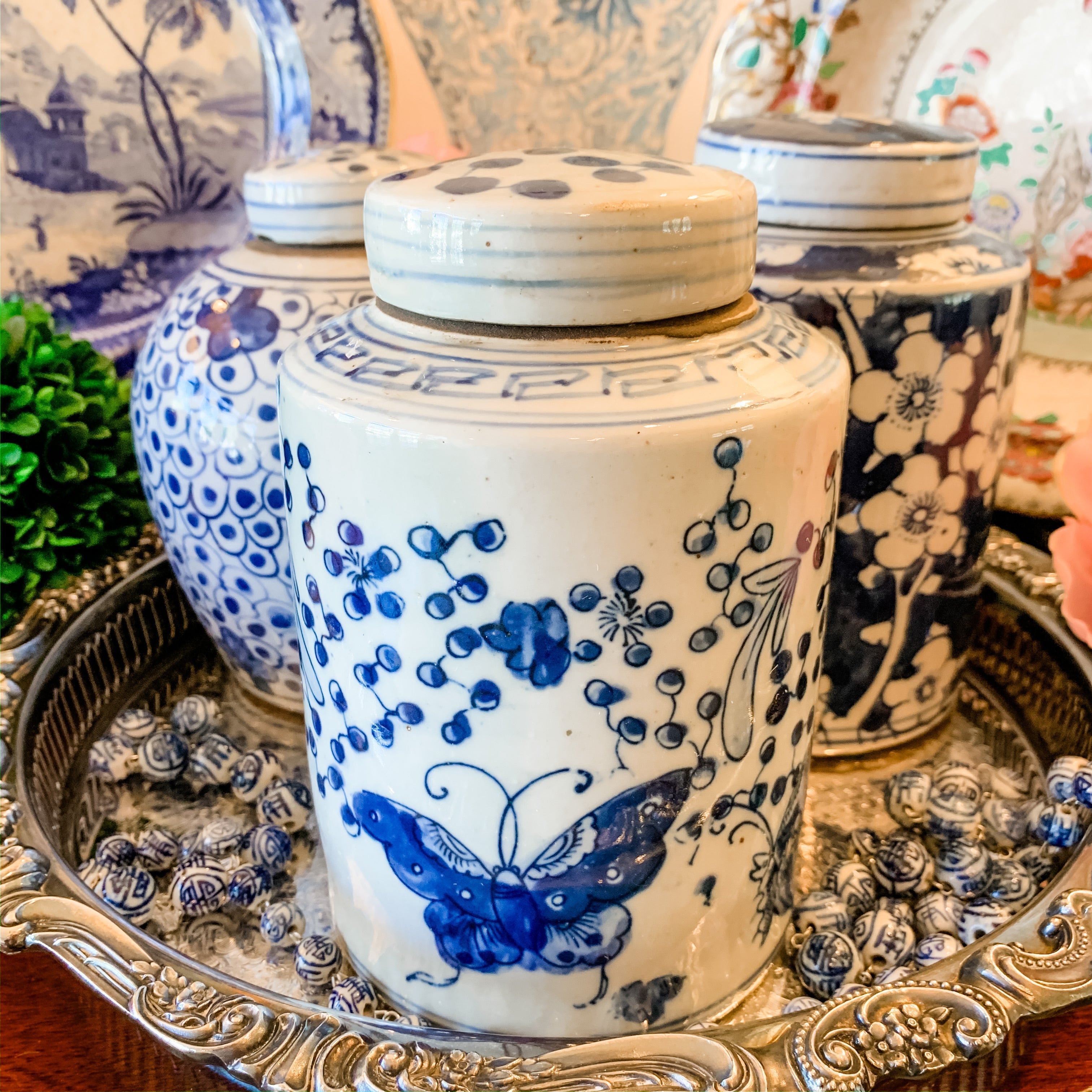 Shop Collectible Brooks for a wide selection of classic blue and white porcelain jars, perfect for adding a touch of chinoiserie to your home decor!  This beautiful hand painted jar is made in the antique style and features a butterfly design.  It stands 7.5" tall.  
