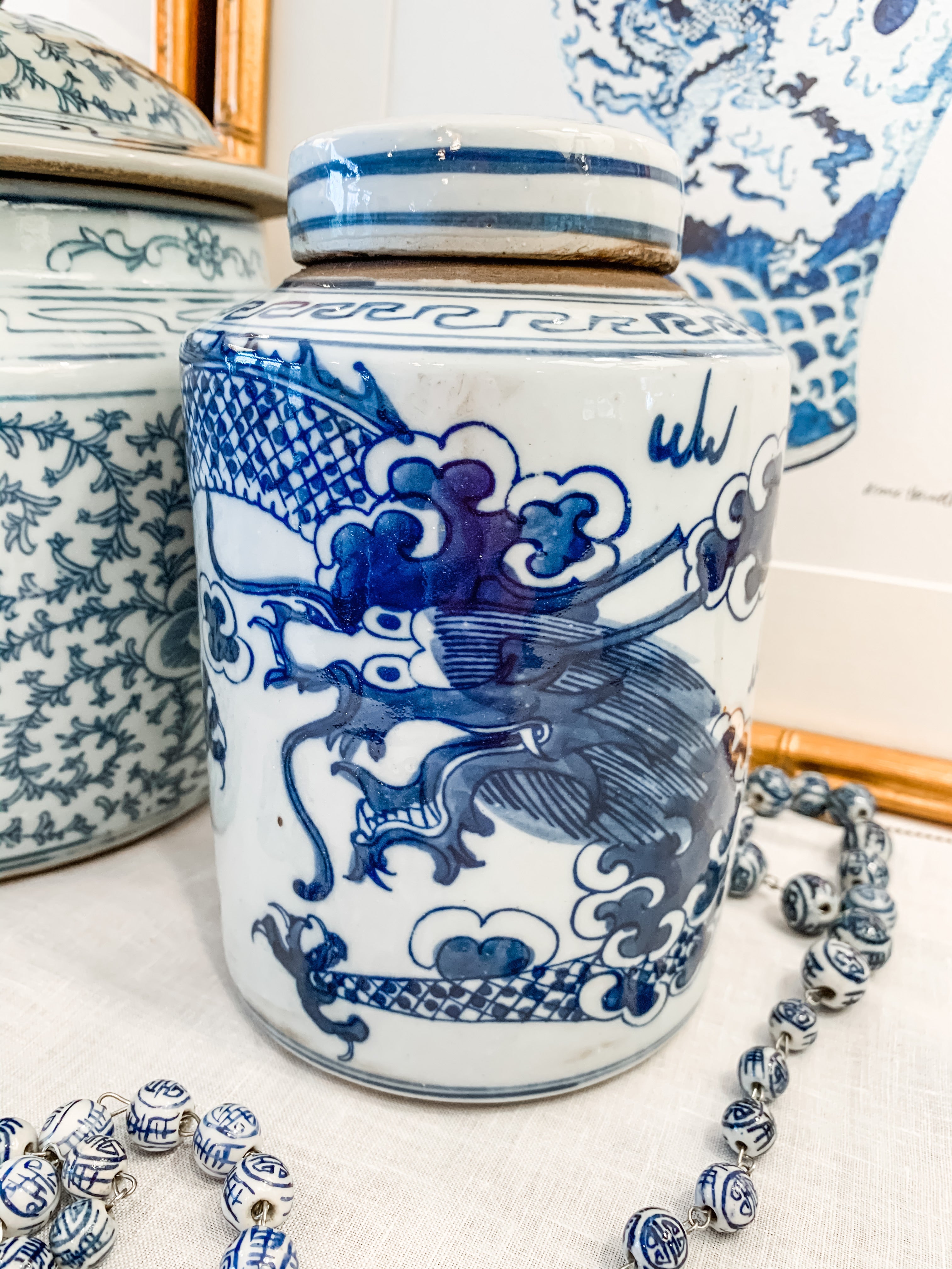 Shop Collectible Brooks for a wide selection of classic blue and white porcelain jars, perfect for adding a touch of chinoiserie to your home decor!  This beautiful hand painted jar is made in the antique style and features a dragon design.  It stands 7.5" tall.  