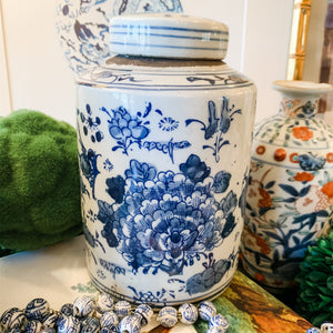 Shop Collectible Brooks for a wide selection of classic blue and white porcelain jars, perfect for adding a touch of chinoiserie to your home decor!  This beautiful hand painted jar is made in the antique style and features a peony and lotus design.  It stands 7.5" tall.  