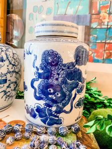Shop Collectible Brooks for a wide selection of classic blue and white porcelain jars, perfect for adding a touch of chinoiserie to your home decor!  This beautiful hand painted jar is made in the antique style and features a foo dog design.  It stands 7.5" tall.  