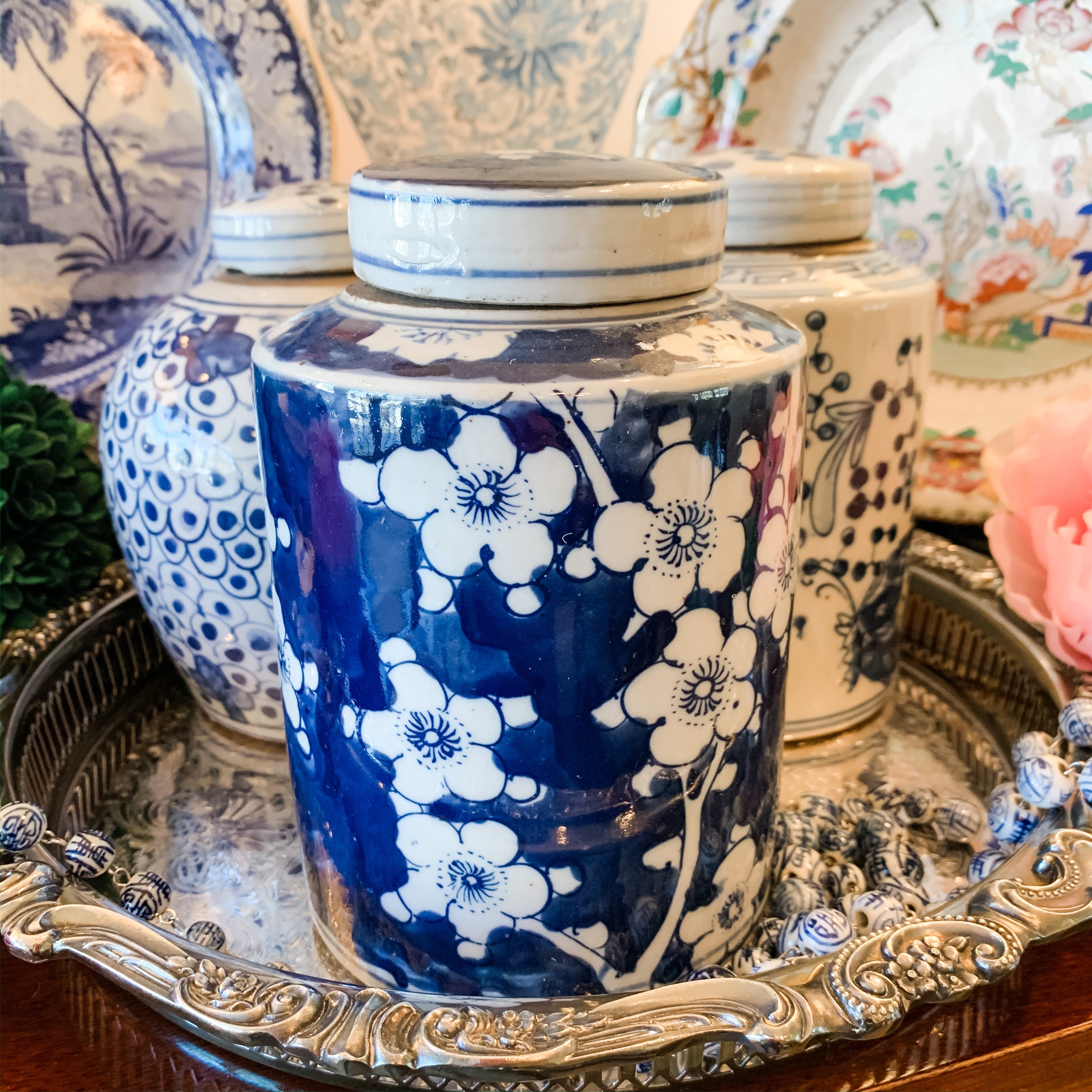 Shop Collectible Brooks for a wide selection of classic blue and white porcelain jars, perfect for adding a touch of chinoiserie to your home decor!  This beautiful hand painted jar is made in the antique style and features a cherry blossom design.  It stands 7.5" tall.  