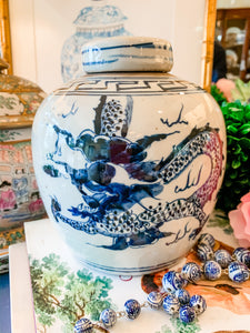 Shop Collectible Brooks for a wide selection of classic blue and white ginger jars, perfect for adding a touch of chinoiserie to your home decor!  This beautiful hand painted jar is made in the antique style and features a dragon design.  It stands 7" tall.  