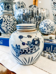 Shop Collectible Brooks for a wide selection of classic blue and white ginger jars, perfect for adding a touch of chinoiserie to your home decor!  This beautiful hand painted ginger jar made in antique style features a fish design and a stands 4.5" tall. 