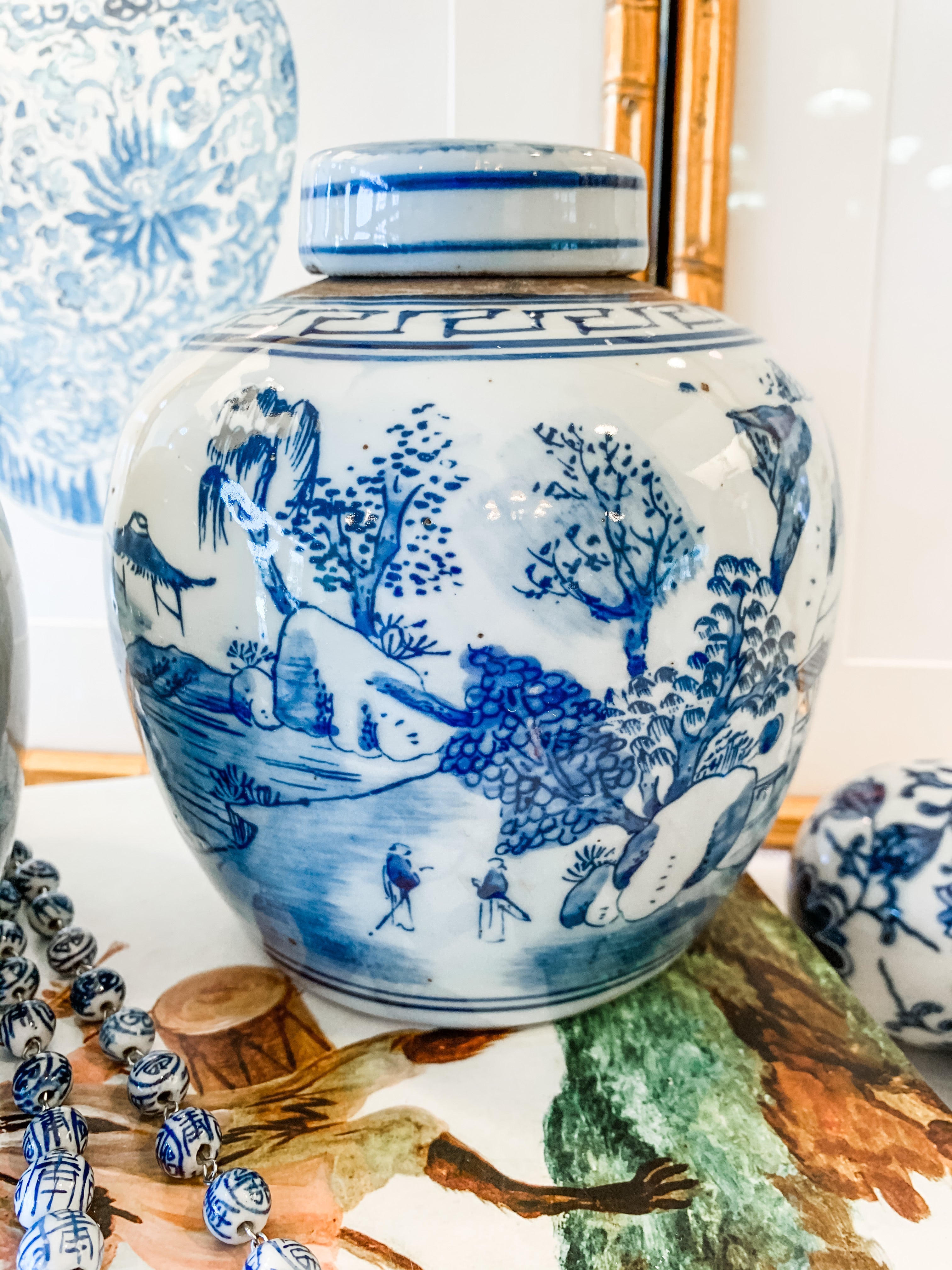 Shop Collectible Brooks for a wide selection of classic blue and white ginger jars, perfect for adding a touch of chinoiserie to your home decor!  This beautiful hand painted jar is made in the antique style and features a landscape design.  It stands 6.5" tall.  