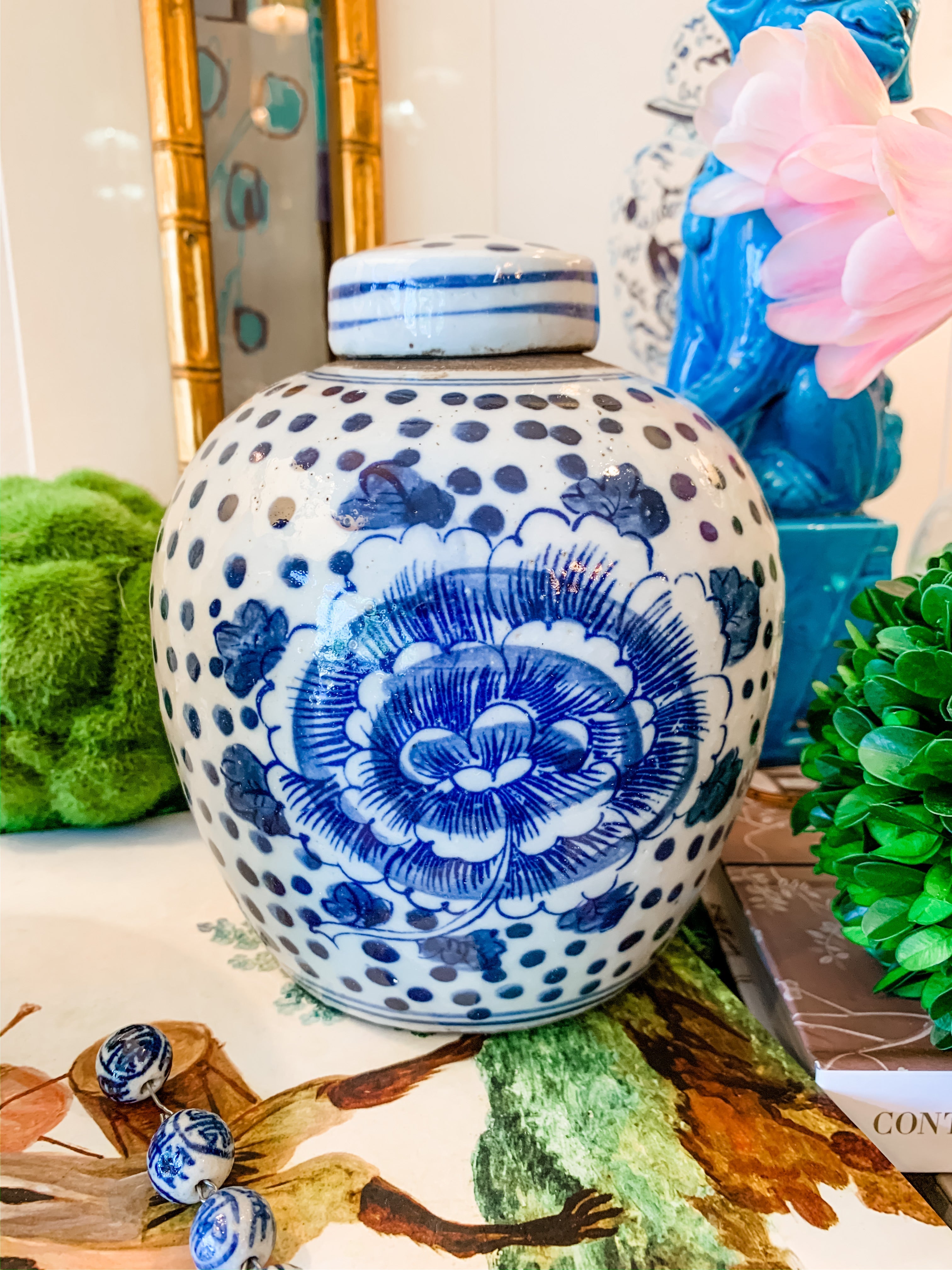 Shop Collectible Brooks for a wide selection of classic blue and white ginger jars, perfect for adding a touch of chinoiserie to your home decor!  This beautiful hand painted jar features a peony and polka dot design and stands 6.5" tall.