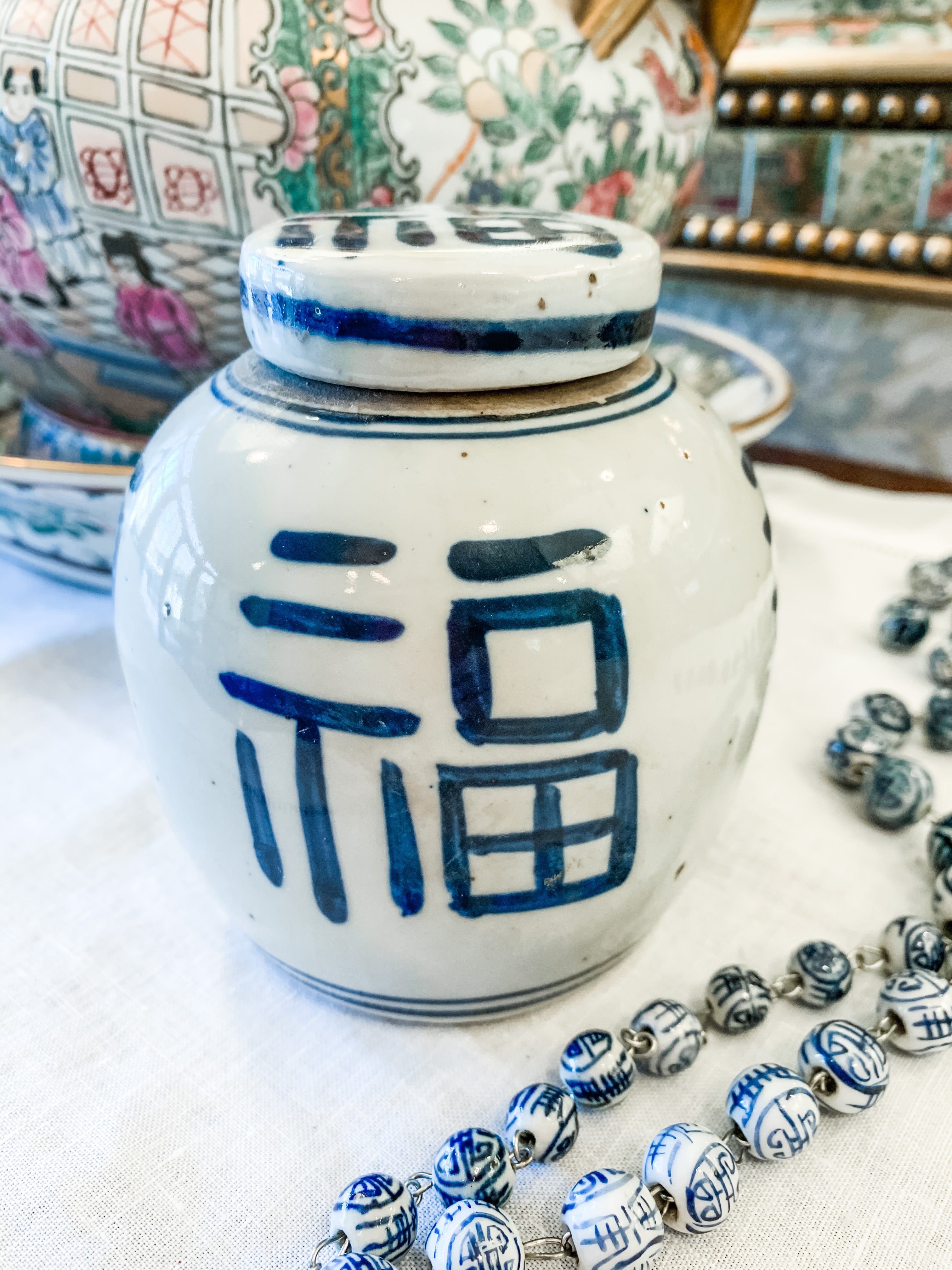 Shop Collectible Brooks for a wide selection of classic blue and white ginger jars, perfect for adding a touch of chinoiserie to your home decor!  This beautiful hand painted ginger jar made in antique style features a happiness symbol design and a stands 4.5" tall. 